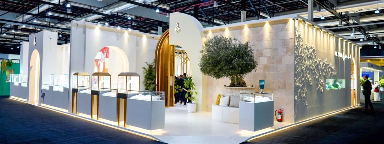 An empty large exhibition stand with counters and towers.