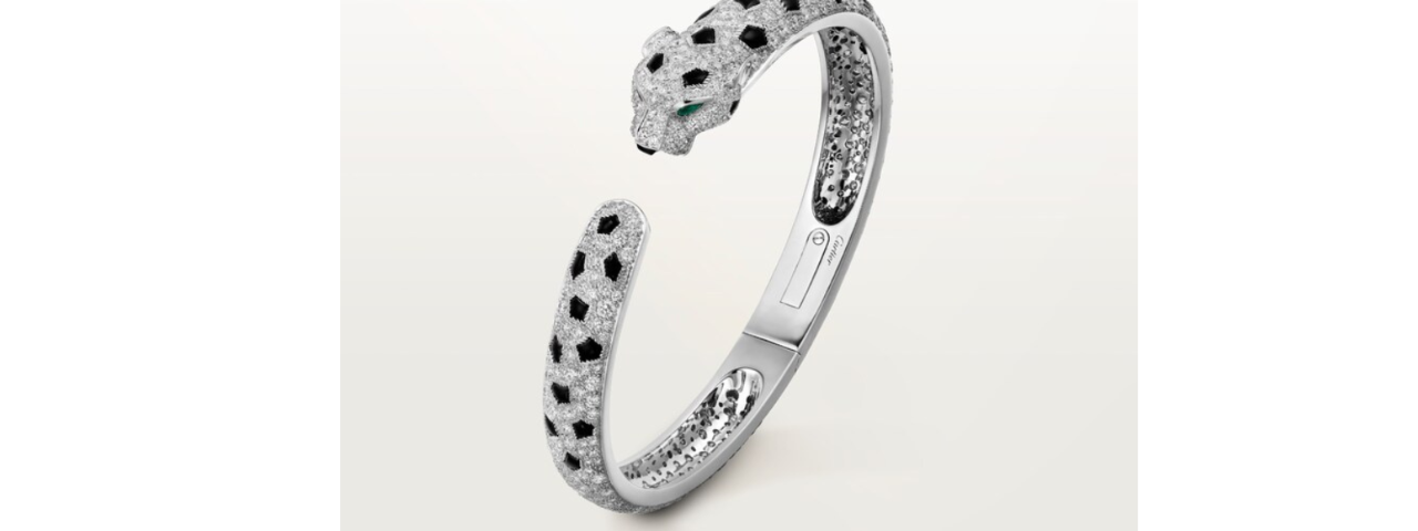 Cartier Panther Bracelet, an Art Deco design featuring a stylized panther with black enamel spots and diamond accents.