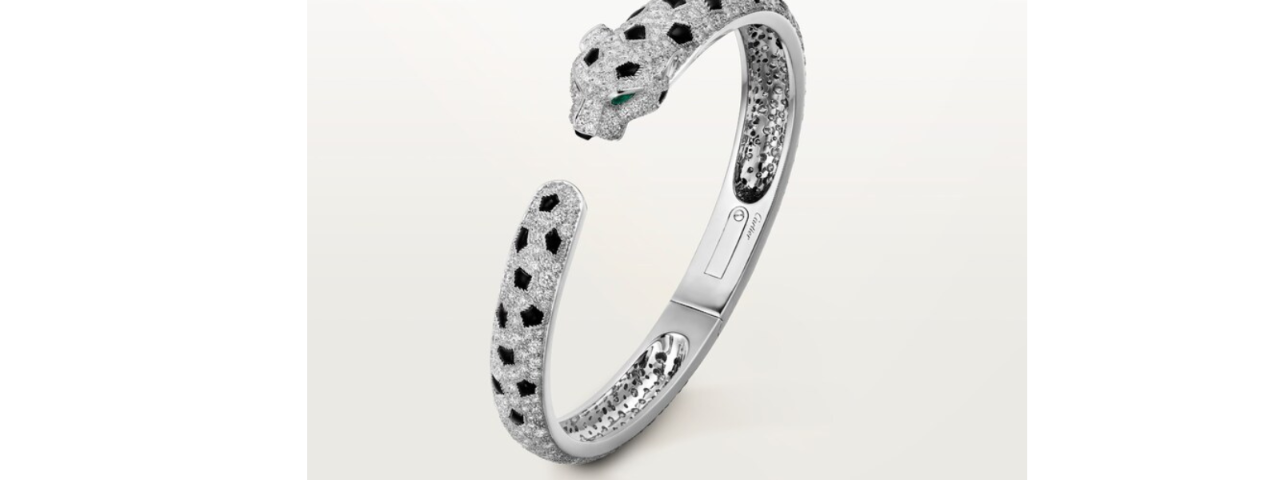 Cartier Panther Bracelet, an Art Deco design featuring a stylized panther with black enamel spots and diamond accents.